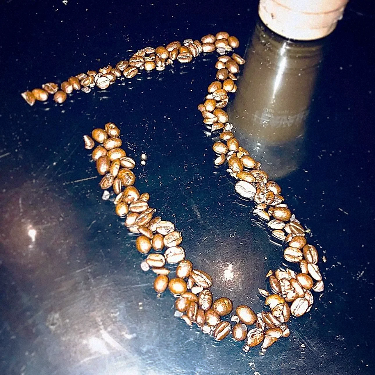Coffee Chemí — the tube emblem drawn in coffee beans
